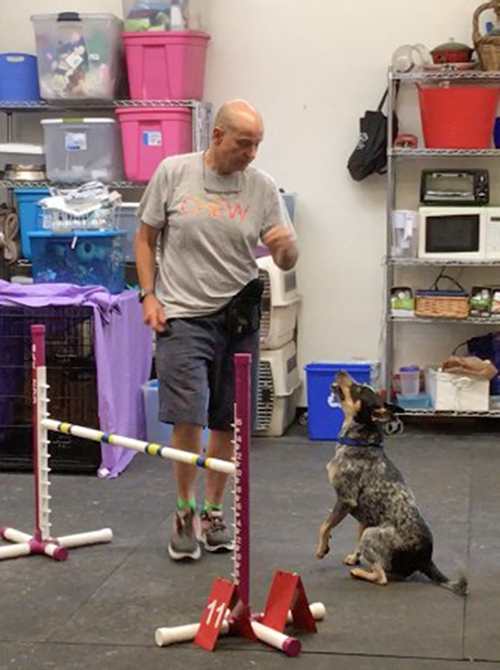 Dave Horner and Ryder sitting near a jump